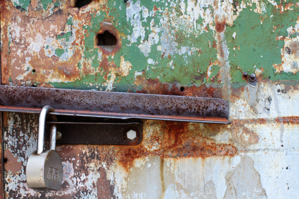 A lock holds a metal door shut near the Gowanus Canal